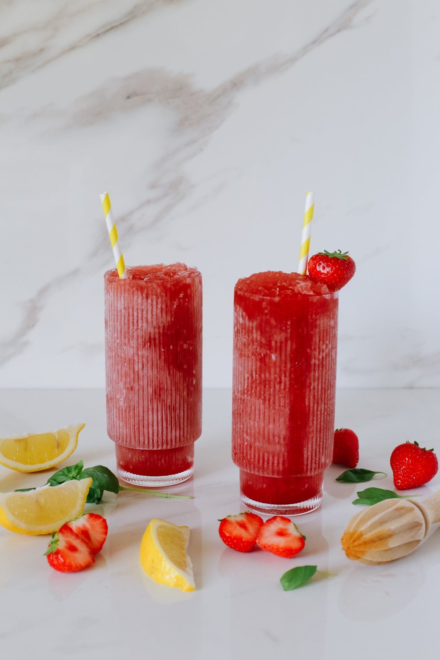 Lush Strawberry Basil Lemonade Slushie, featuring a refreshing blend of strawberries and basil for a delightful frozen treat.