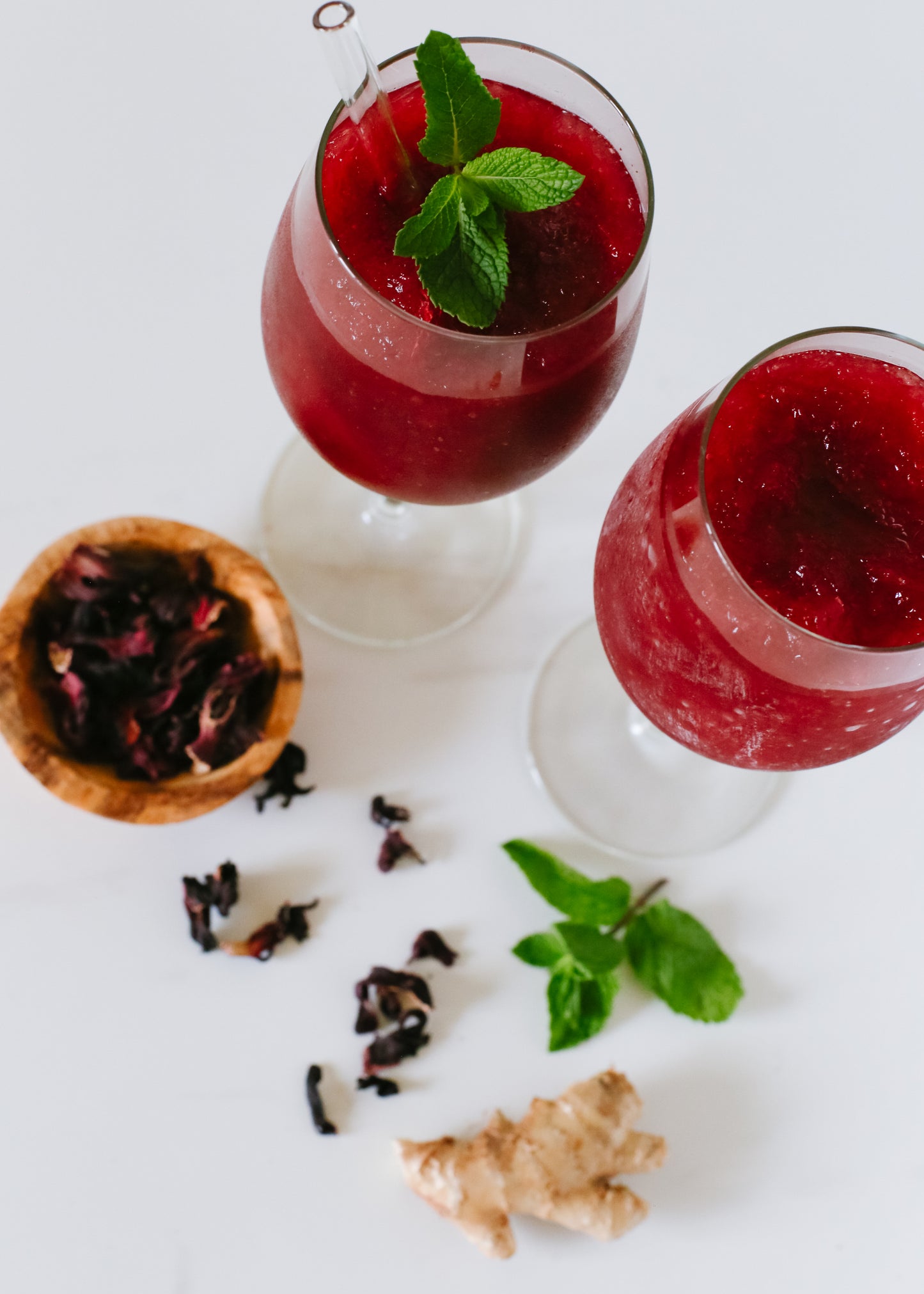 Lush Ginger Hibiscus Slushie, showcasing a vibrant and refreshing frozen drink with a zesty blend of ginger and hibiscus.






