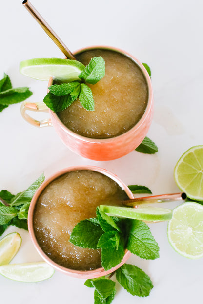 Lush Moscow Mule Slushie, a refreshing frozen drink with zesty lime and ginger flavors.






